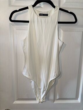 Women’s high-neck cream body suit soft and silky snap close size small us 4